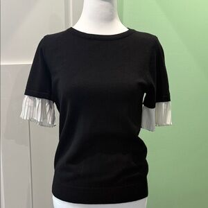 Chic Vila Milano Black Sweater with White Ruffle Sleeves.